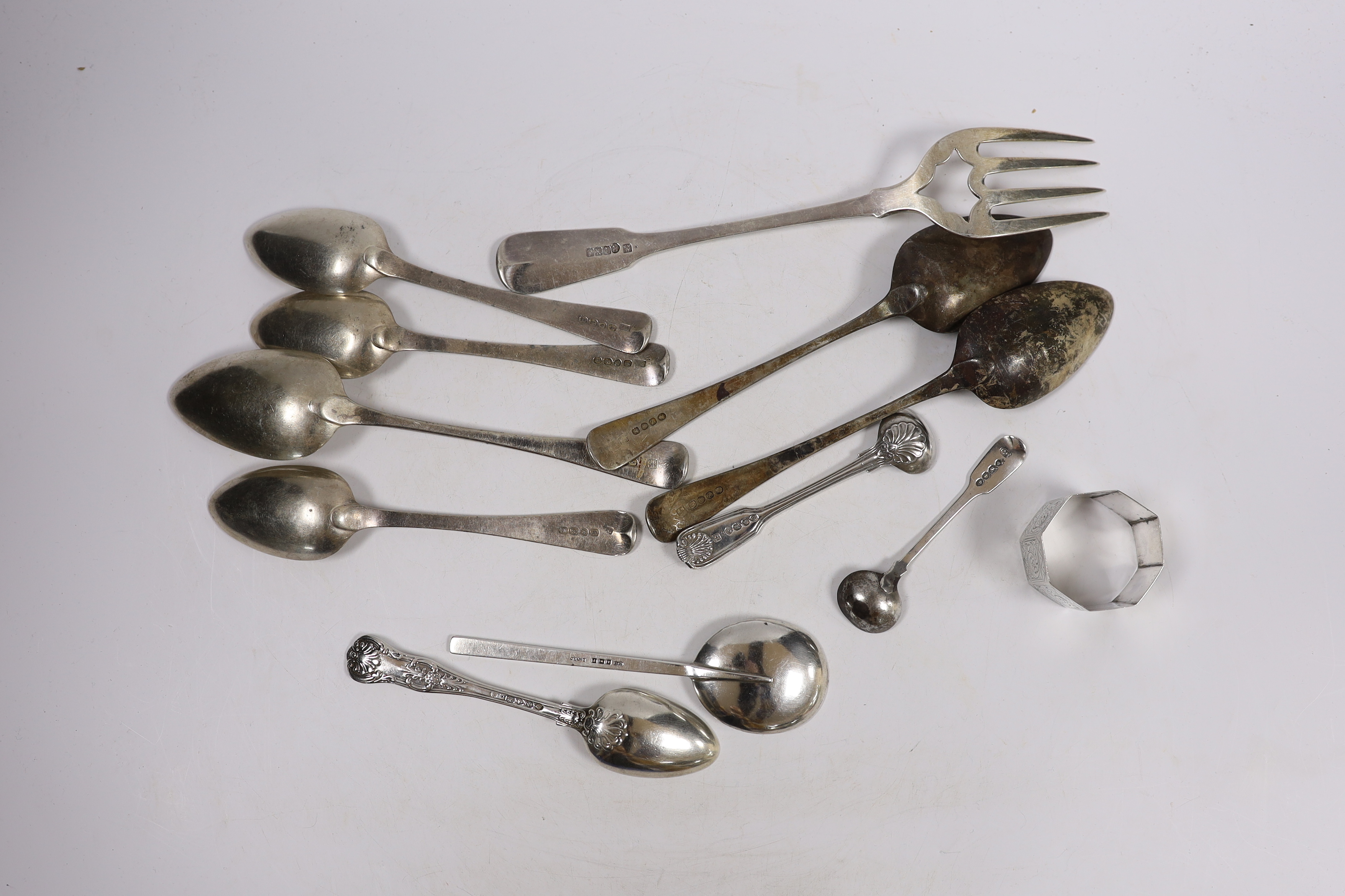 Eleven assorted items of mainly 19th century silver flatware and a silver napkin ring, 18oz.